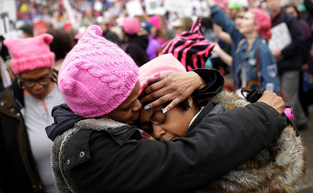 A mother embraces her daughter during the Women’s March on Jan. 21, 2017, in Washington, D.C. (Joshua Lott/AFP/Getty Images)